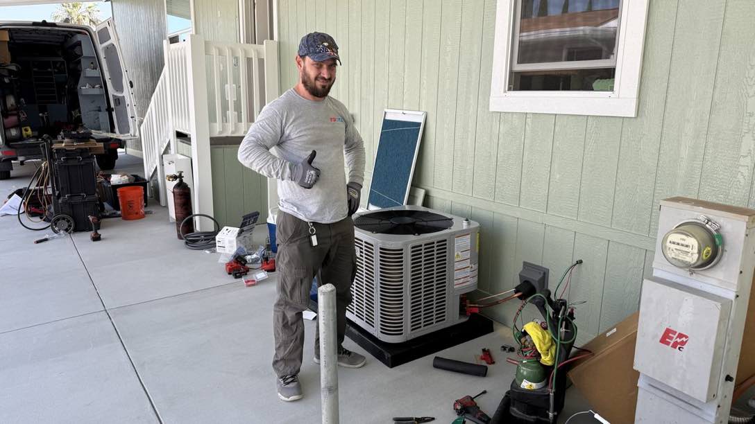 Prime Air Solutions technician servicing an air-conditioning unit in San Diego