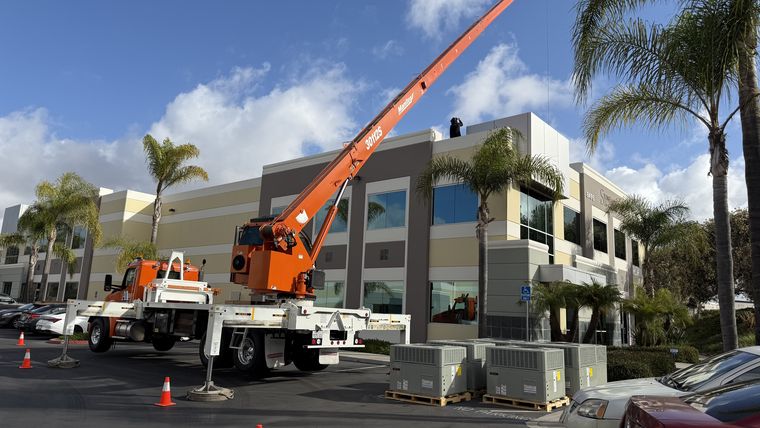 Crane truck at commercial HVAC jobsite