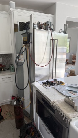Built-in refrigerator with refrigerant gauges